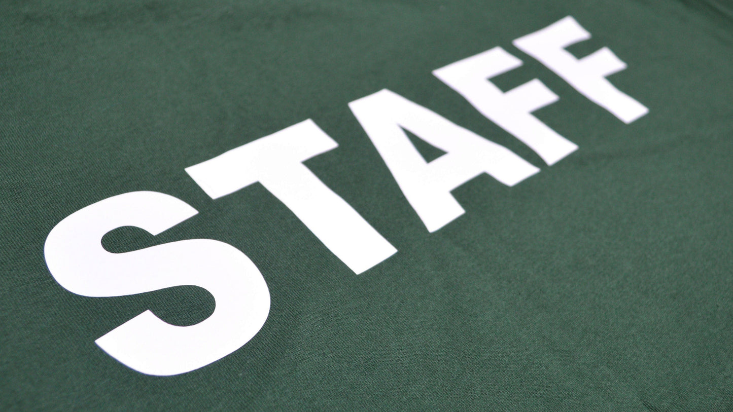 Green shirt with 'STAFF' printed in white on a plain background